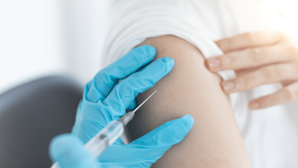 a person getting an injection in the arm