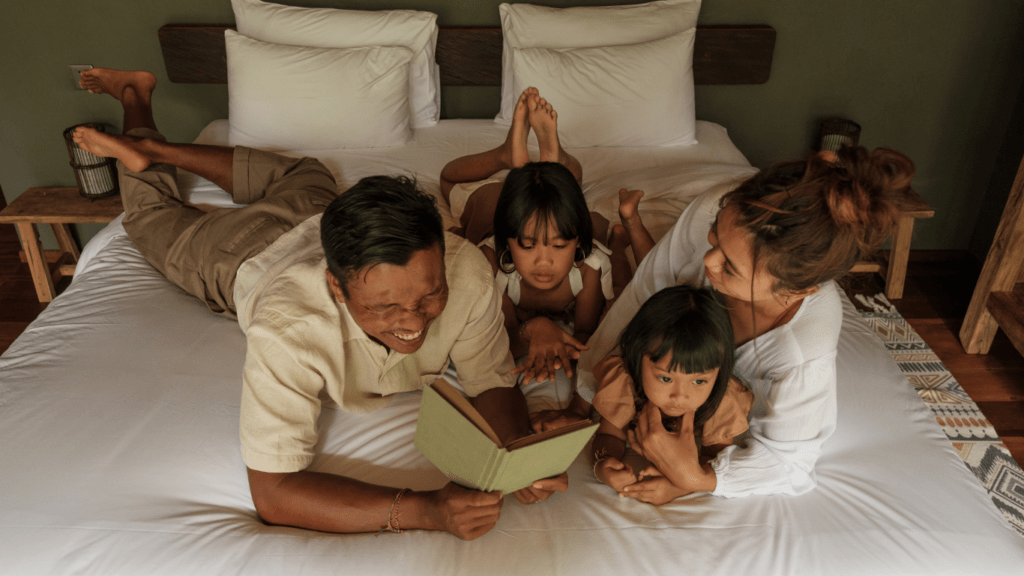 an image of a family laying on the floor together