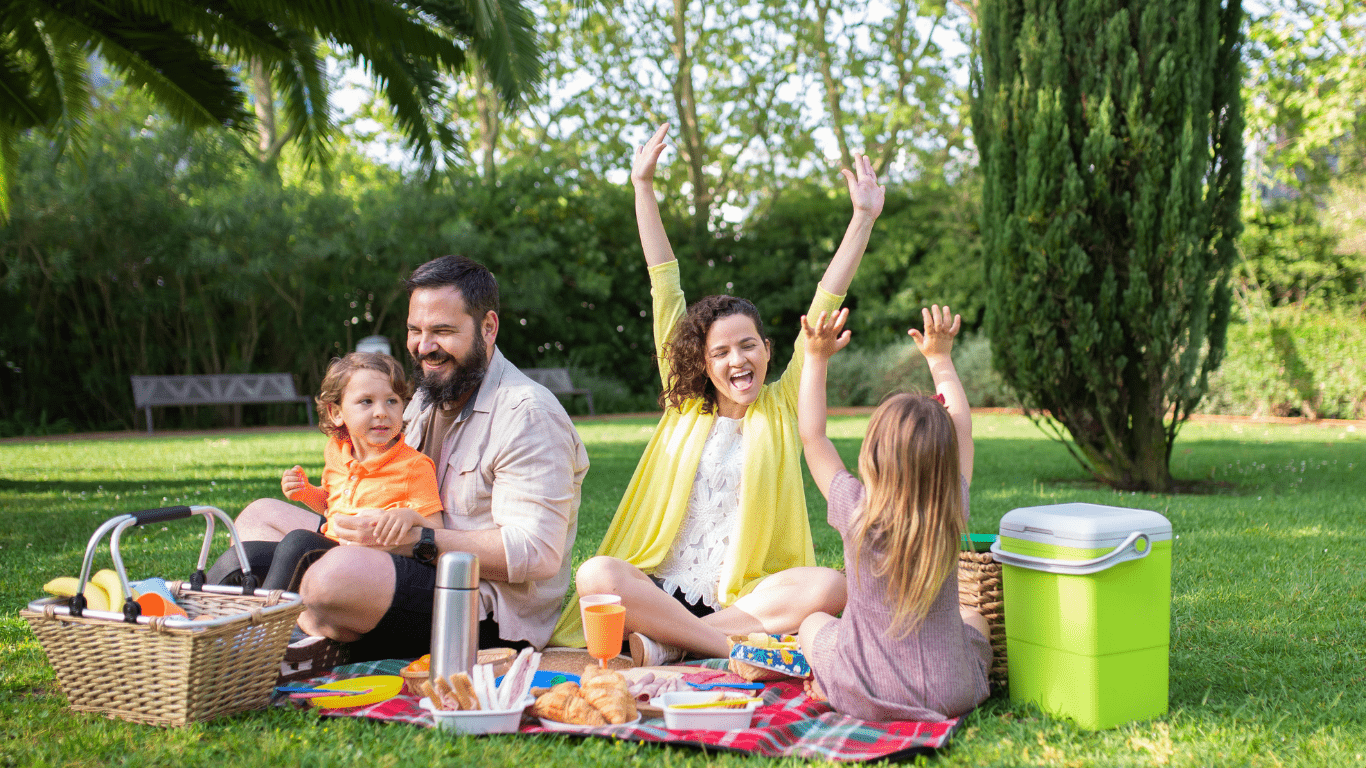 a family having a picnic in the park