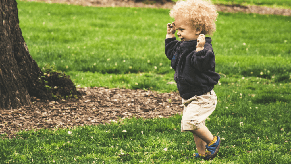 a toddler playing in the park