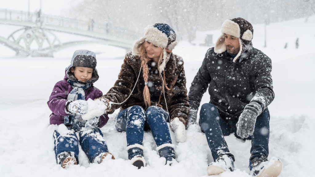 a group of person playing in the snow