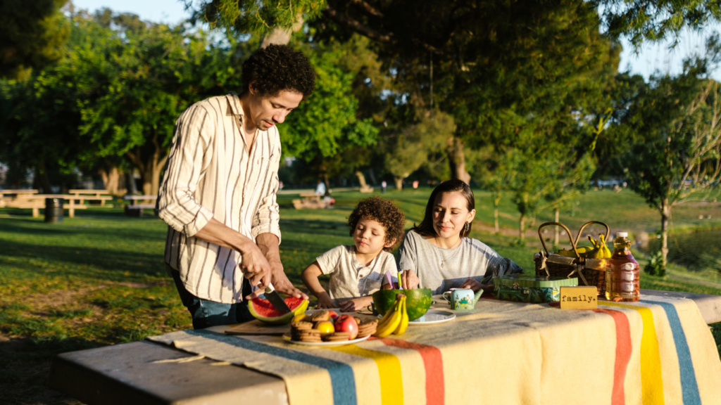 a family having a picnic in the park