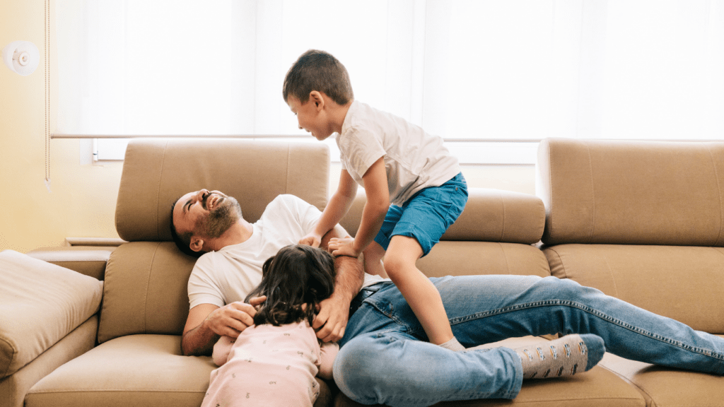 a family sitting on a couch 