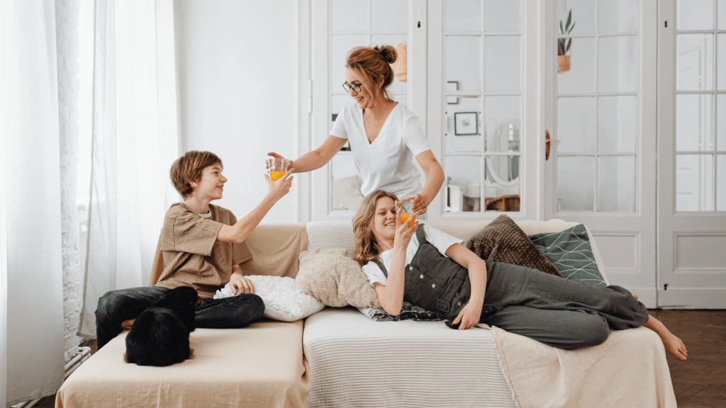 a family sitting on a couch in a living room