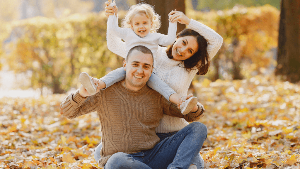 a family sitting on a floor