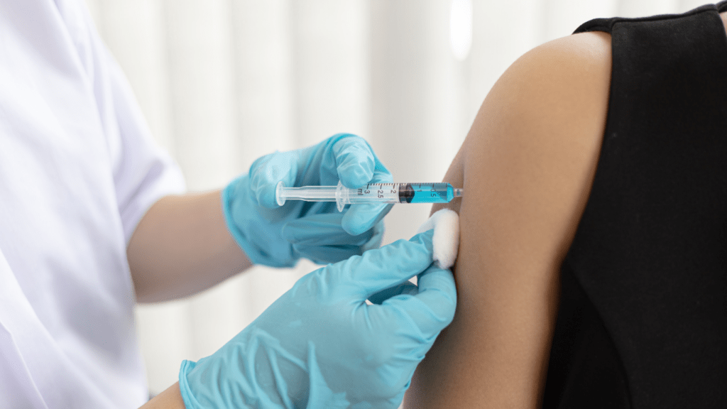 a person getting an injection in the arm