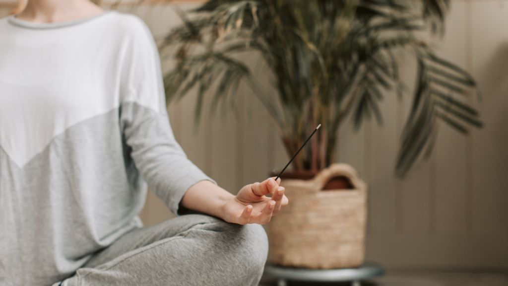 a person is sitting in the middle of a yoga pose