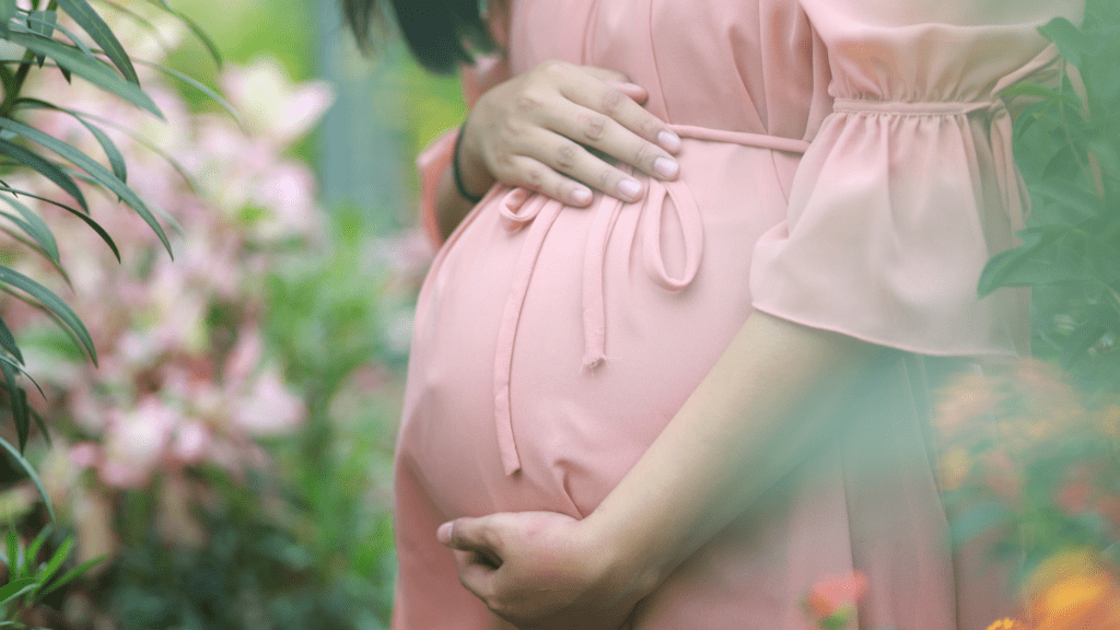 a person with their hands on their stomach