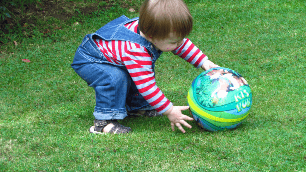 a toddler playing in the park